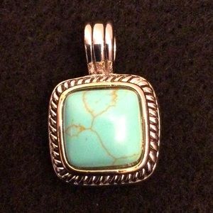Pendant silver tone with turquoise colored center